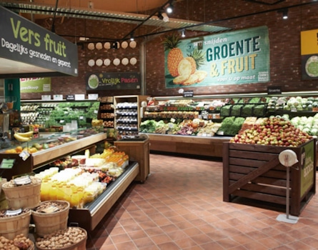 Studio Königshausen's retail design for Jumbo Supermarket in Breda, The Netherlands, aims to enhance the food shopping experience. Jumbo, a family-owned supermarket chain, wanted to elevate food preparation and enjoyment in their stores while maintaining affordability and convenience.